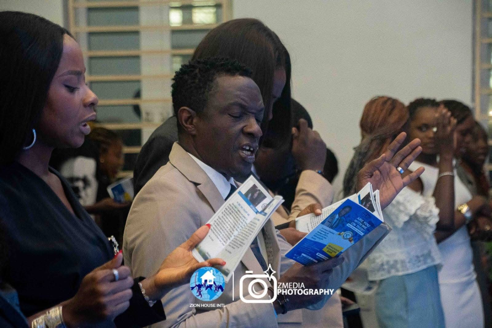 Congregation holding affirmation booklets